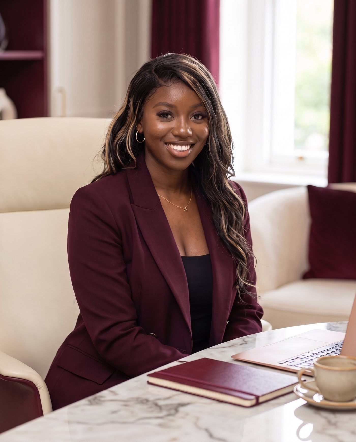 Grace Matuta, founder of Grace Builds HQ, at her desk